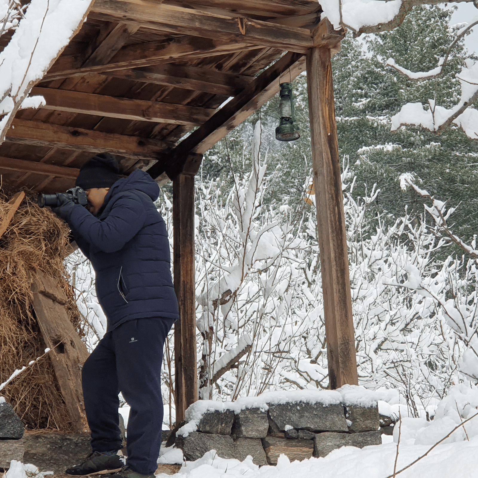a photographer in remote village house in manali