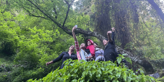 goup of people taking selfie in forest in Soil Village on a offbeat holiday in himachal