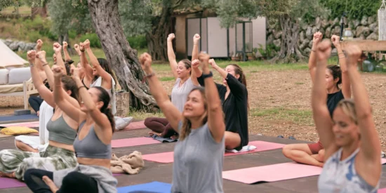 group of people doing yoga on a Spiti Valley Tour by YoloO Life