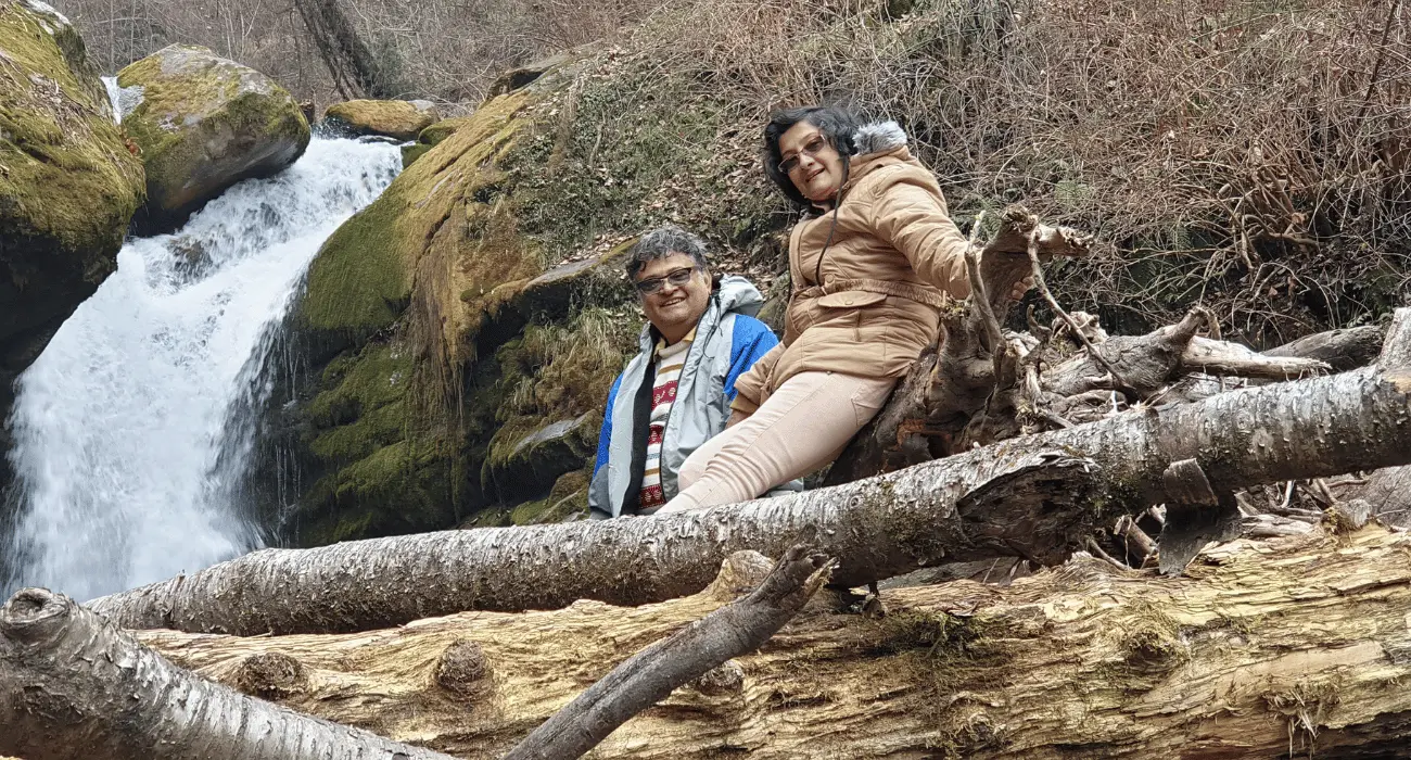 a senior couple at Crystal Falls in VanVaas, Soil village, Manali